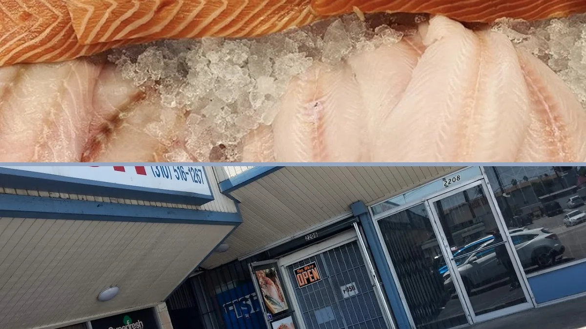Counter with fish, shrimp, and sides.